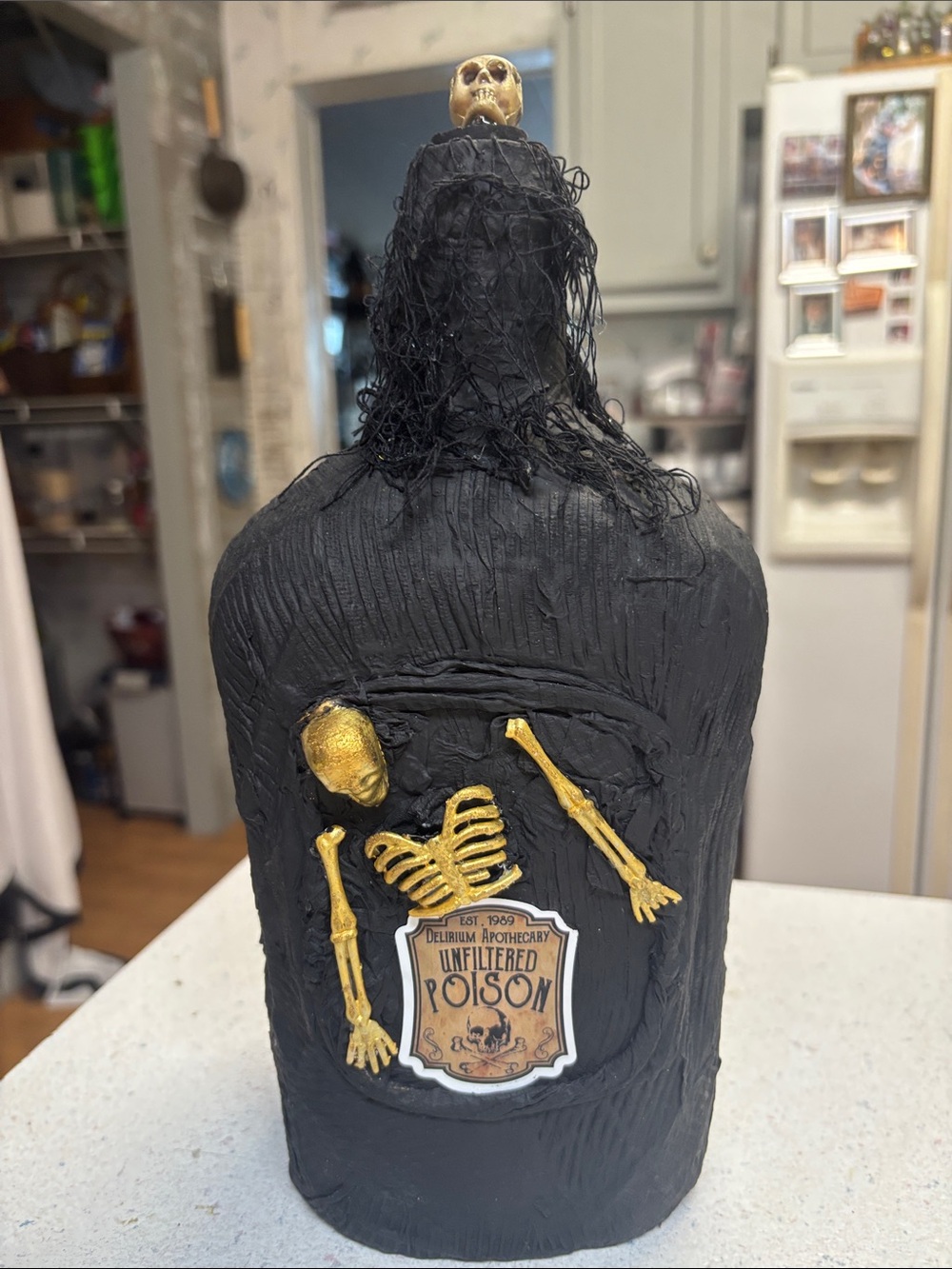 Black Decorative Apothecary Bottle with Gold Skeleton Accents